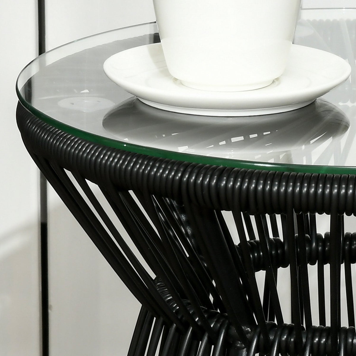 Rond bistrotafel van glas met holle trommelvoet, zwart