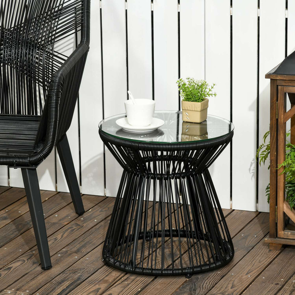 Rond bistrotafel van glas met holle trommelvoet, zwart